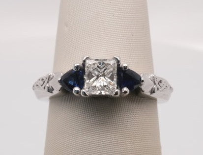 18K WG ENG RING WITH PRINCESS CENTER 0.50CTW VS1/G SAPPHIRE 0.38CTW
