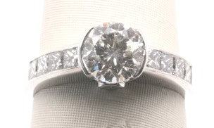 18K WG ROUND CENTER 1.13CT SI1/H PRINCESS SIDES 0.83CT DIAMOND RING