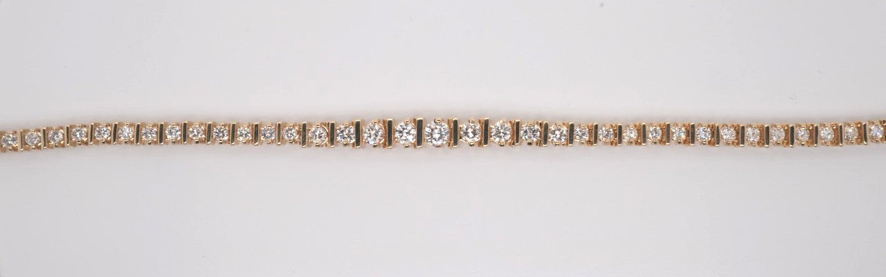 LADIES 14K YG ROUND DIAMOND GRADUATED BRACELET APX 5CTW