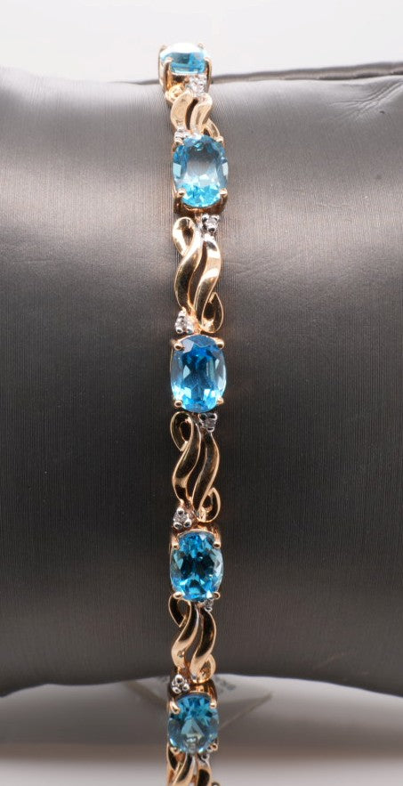 14K YG BLUE TOPAZ AND DIAMOND BRACELET