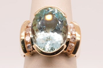LADIES 14K YG BLUE ZIRCON OVAL FANTASY CUT WITH ROUND DIAMONDS