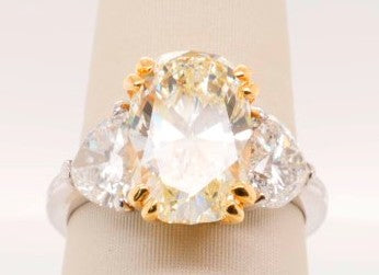 LADIES PLATINUM & 18K YG RING 5.01CT OVAL VS2.K WITH 2.52CTW HEARTS