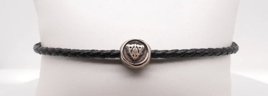 GUCCI Woven Black Leather Bracelet with Sterling Silver Crest